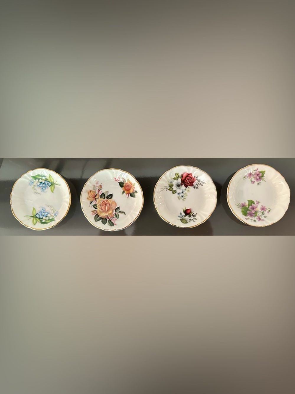 Four Princess House/Spode butter pats.